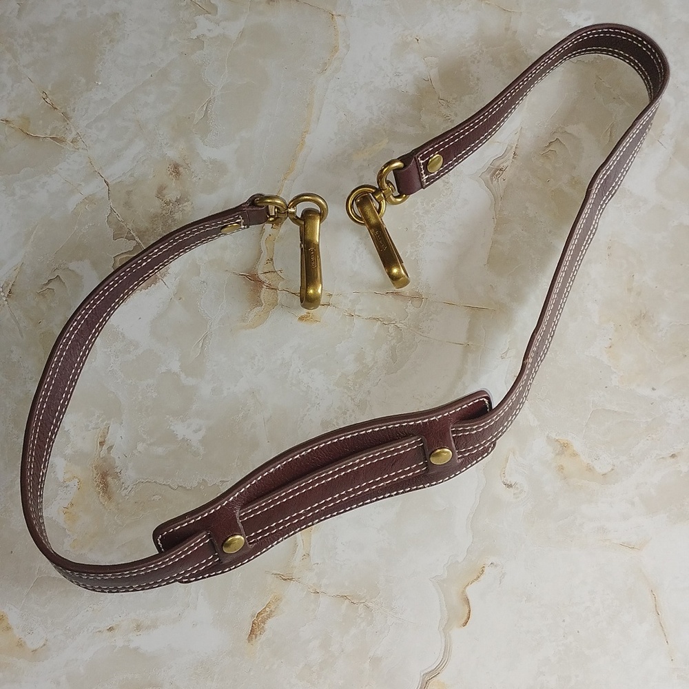 Coach Brown leather shoulder strap with comfort pad.
